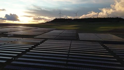 Forward Moving Aerial View Over Solar Panels at Sunset Stock Footage 325127645