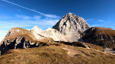 Forward moving on Alps saddle edge with Mangart mountain Stock Footage 122211441