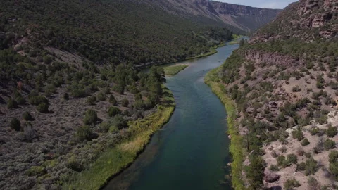 Forward moving and rotating aerial view of Green River in Utah with fishing.. Stock Footage 276414935