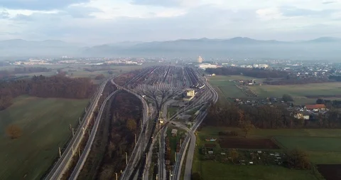 Forward moving drone aerial view of a large railway depot in the suburbs Stock Footage 105926845