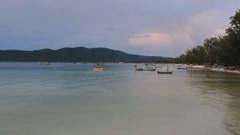  Forward moving drone view of island coast and a black girl passing through the  Stock Footage 111285317
