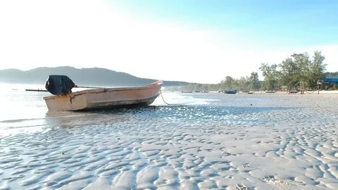  Forward moving drone view of island coast and passes very close to boat Stock Footage 111333794