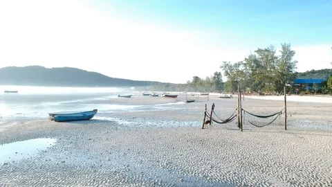  Forward moving drone view of island coast over dogs, hammocks and boats Stock Footage 111334141