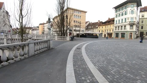 Forward moving empty Triple Bridge and Preseren main square on workday Stock Footage 127519986