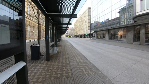 Forward moving walking empty Ljubljana street and bus station, no passengers Stock Footage 127832715