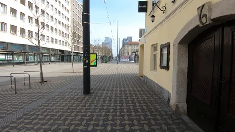 Forward moving walking on empty Ljubljana street and square Stock Footage 127833020