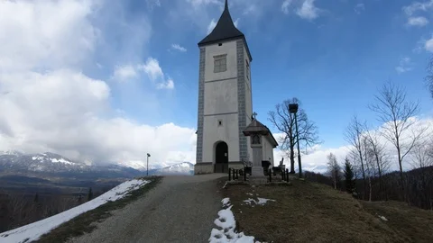 Forward moving walking towards old small church on Jamnik hilltop Stock Footage 127908622