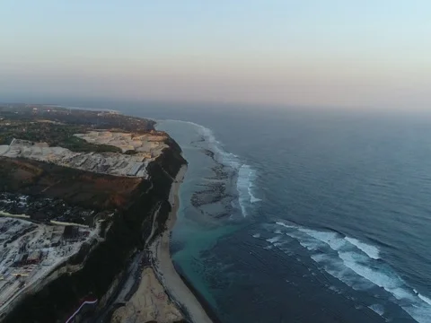 Forward over the beach, cliffs, and ocean in Bali, Indonesia. Stock Footage 80178303