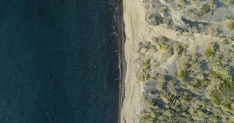 Forward overhead aerial on mediterranean sea wild coast, blue water.Nature Stock Footage