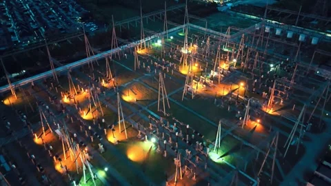 Forward Overhead Aerial View of Electrical Substation at Night Stock Footage 342145514