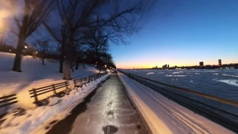 Forward POV Ride on NYC Riverside Bike Path With Snow and Passing Cars at Sunset Stock Footage 332171047