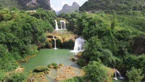 Forward Push Drone Shot Above Multi Tier Forest Waterfalls Guangxi China Video stock 330279995