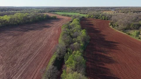 Forward Push Over Creek Through Farmland in Oklahoma Aerial Stock Footage 332128160