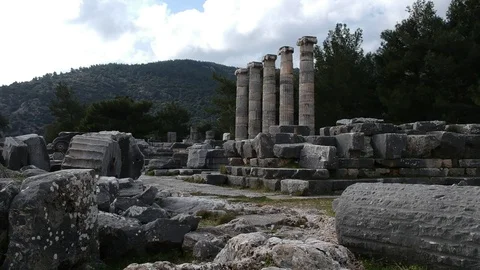 Forward slow flight from the ground to Athena Temple columns Stock Footage 104008810