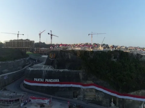 Forward toward rock cliffs and construction in Bali Indonesia. Stock Footage 80156665