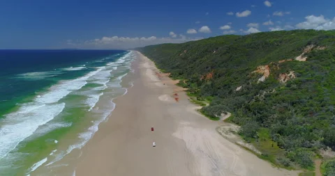 Forward tracking aerial of beach with 4x4 vehicles, Fraser Island,QLD,Australia Stock Footage 140533309