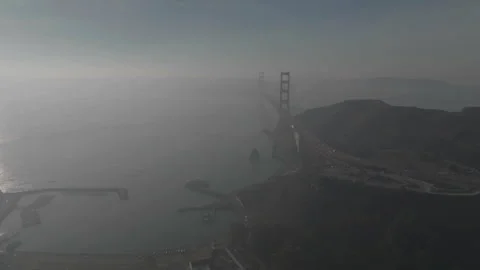 Forward tracking drone toward San Francisco bridge in fog Stock Footage 336792950