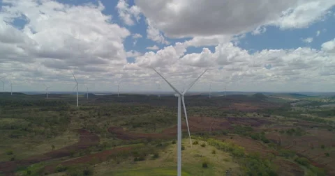Forward tracking drone view of  Wind Turbines at wind farm, QLD, Australia Stock Footage 297589456