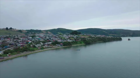 Forward tracking with ocean foreground and hill middle Stock Footage 340993305
