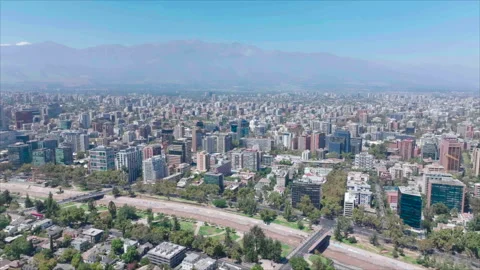 Forward tracking overall view of Santiago with mountains background Stockbeeldmateriaal 340993770