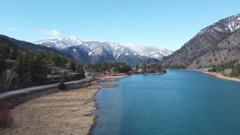Forward tracking shot over pristine river in Montana valley Stock Footage 211110765