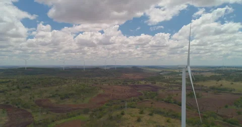Forward tracking view of  Wind Turbines at wind farm, QLD, Australia Stock Footage 297591355