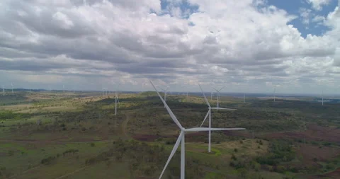 Forward tracking view of  Wind Turbines at wind farm, QLD, Australia Stock Footage 297596507