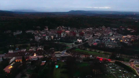 Forward tracking of village with forests behind Video stock 347585428