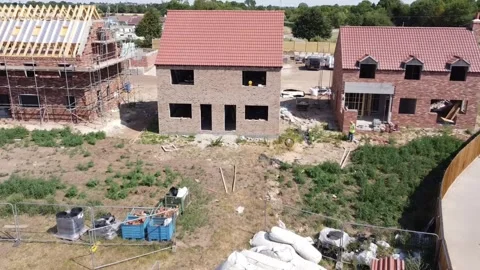 Forward view of a new house under construction flying directly at the Vídeos de archivo 202304468