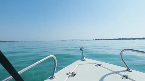 Forward view from a small boat cruising on calm turquoise waters near Diaporos Stock Footage 346665330