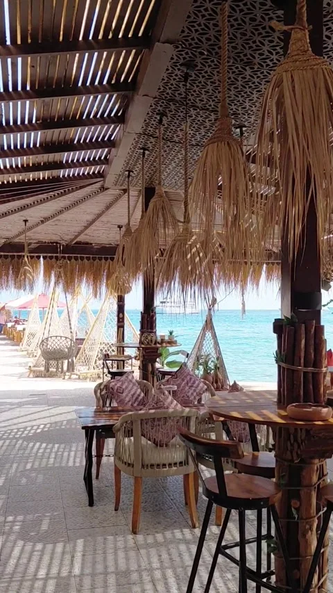 A forward walk through an open-air cafe Stock Footage 335593884