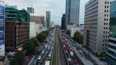 Forwards fly above long queue of vehicles stuck in traffic jam on wide street in Stock Footage 165367619