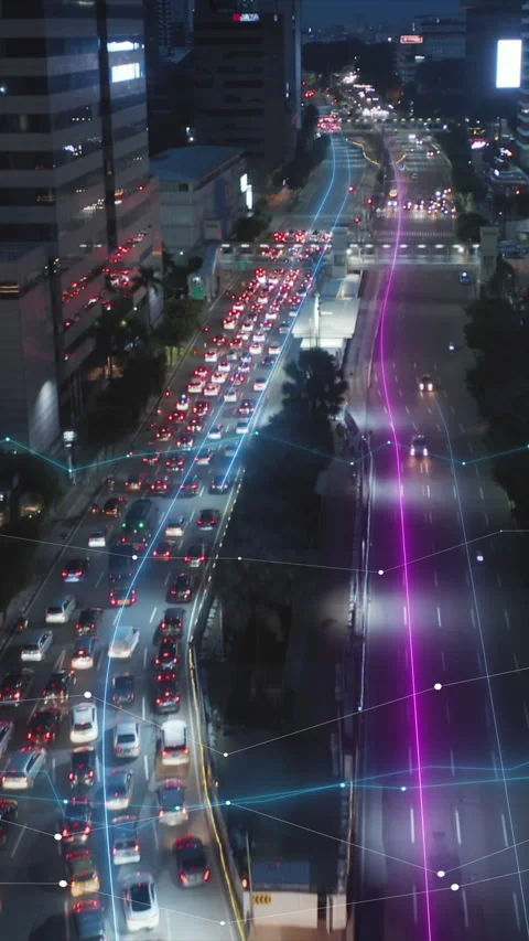 Forwards fly above thoroughfare in modern metropolis at night. Queue of cars at Vídeos de archivo 323713872