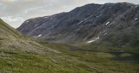 Forwards going drone shot of a mountain valley in Norway Stock Footage 210541722