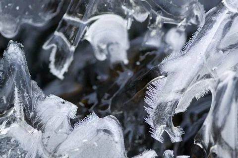 Fost patterns on a partially frozen stream Stock Photos