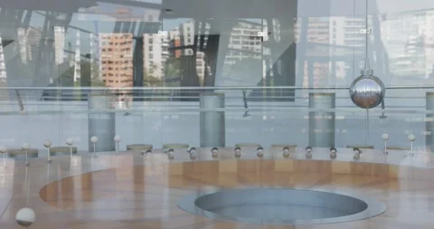 Foucault Pendulum copper ball swinging inside modern building closeup Stock Footage 287916340