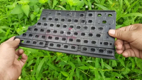 Found a broken computer keyboard in the green grass area Stock Footage 296341566
