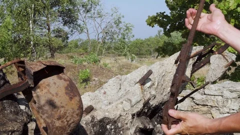 Found a German bayonet, and a rusty rifle. Stock Footage 95228214