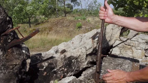 Found a German bayonet, and a rusty rifle. Stock Footage 95228486