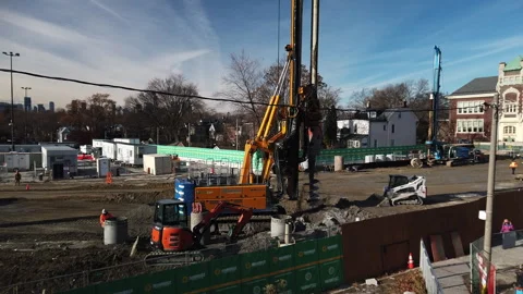 Foundation drilling auger machine rotating and dumping excavated earth on Video stock 324387495