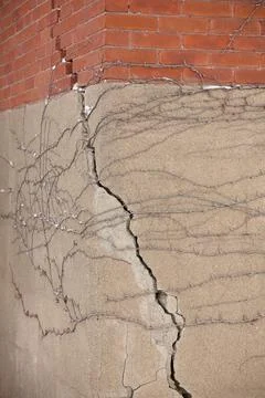 Foundation with Large Crack that extends into the brick wall above it Stock Photos