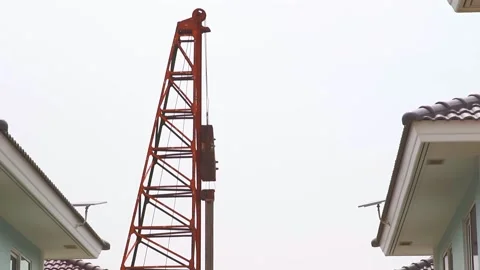 Foundation pile being hammer into the ground at a contruction site Video stock 158753545