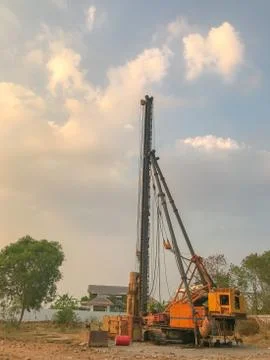 Foundation pile drilling machine in construction site Stock Photos