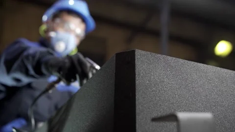 In the foundry, the worker cleans the molds with compressed air. Stock Footage 146636107