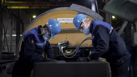 In the foundry, the worker cleans the molds with compressed air. Stock Footage 146636222