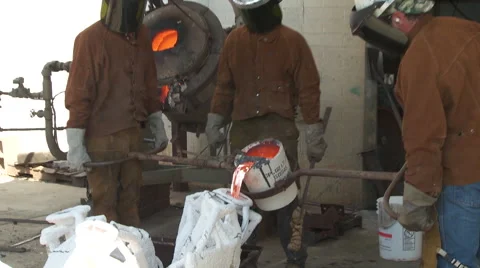 Foundry Worker Pouring Metal Stock Footage 57359029