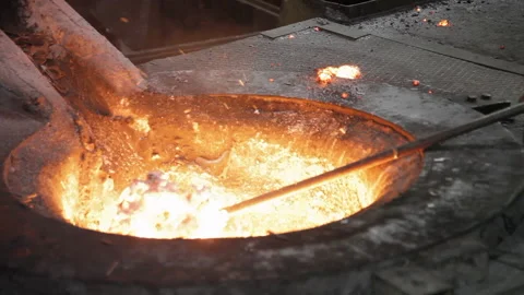 Foundry worker take out melted metal Stock Footage 231497049