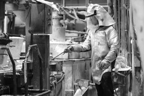 Foundry worker taking samples Stock Photos