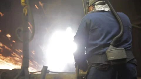 Foundry worker using a circular saw Stock Footage 231496771