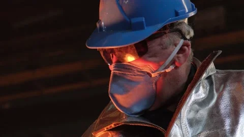 Foundry worker working with molten metal Stock Footage 197140463